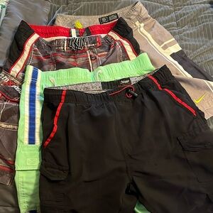 Four boys swimsuits size 10/12.